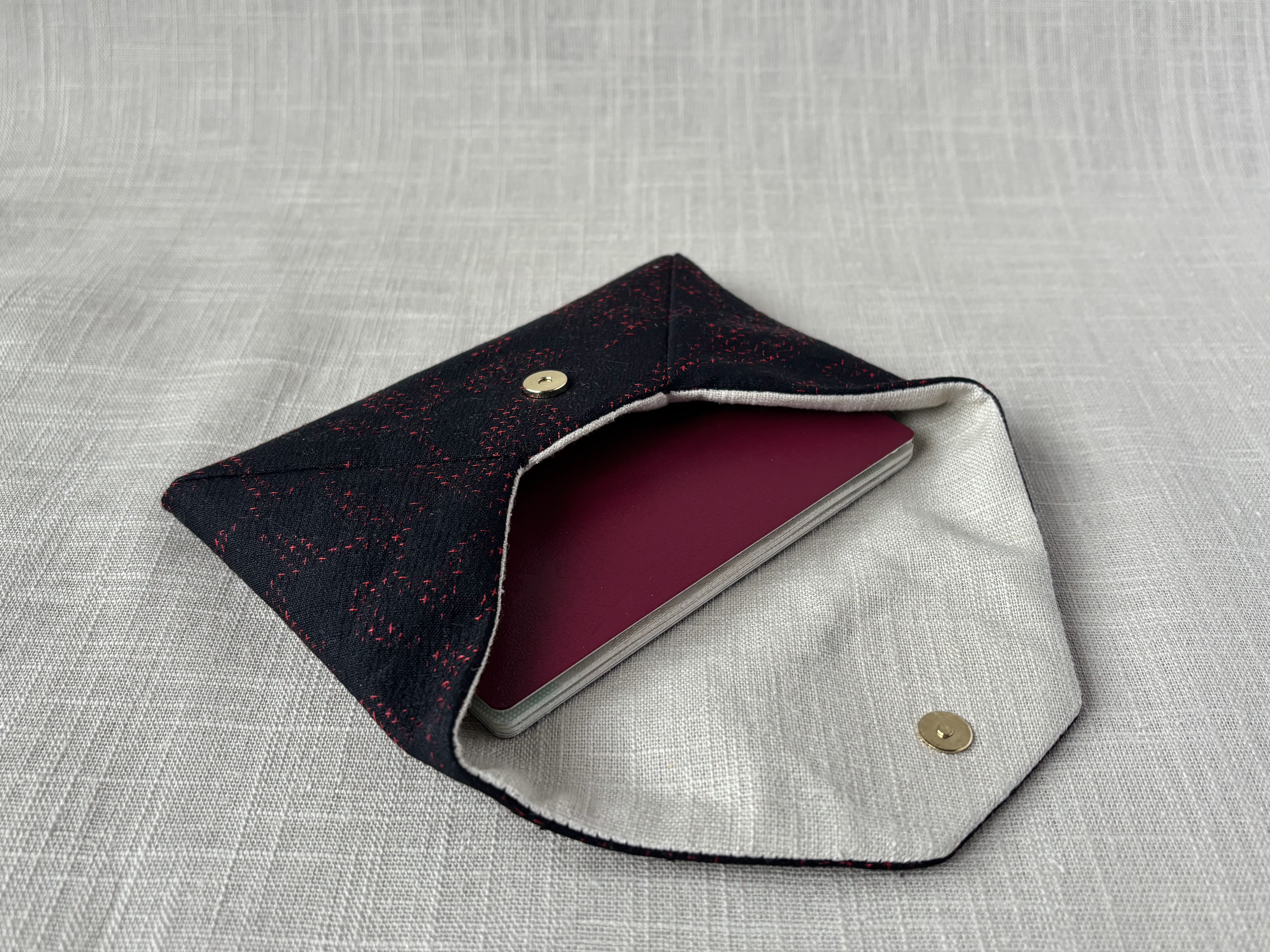 Side view of the sukiya bag showing a passport inside.